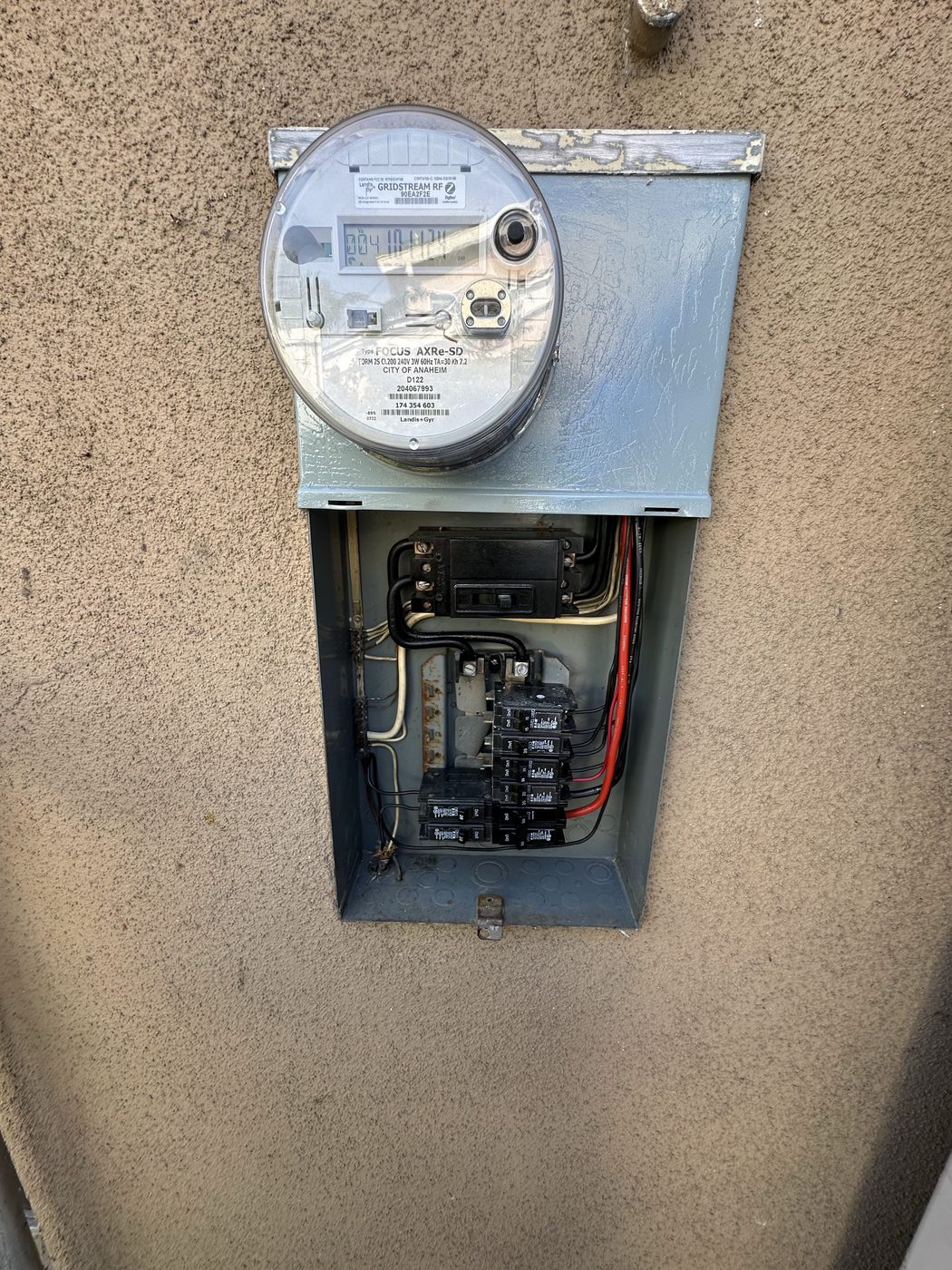 200 amp electrical panel upgrade beside utility meter